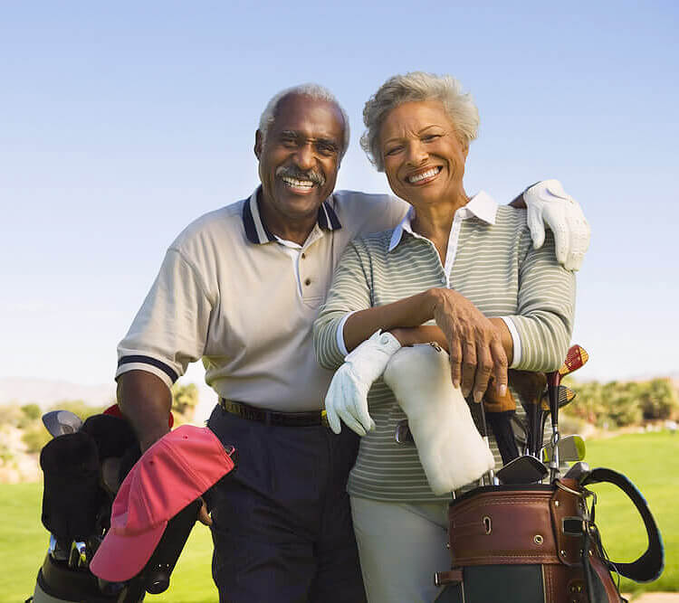 Senior couple playing golf