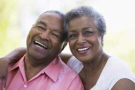 Senior couple smiling and embracing