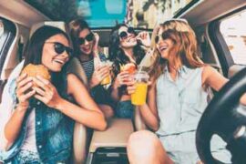 Group of women in a car laughing