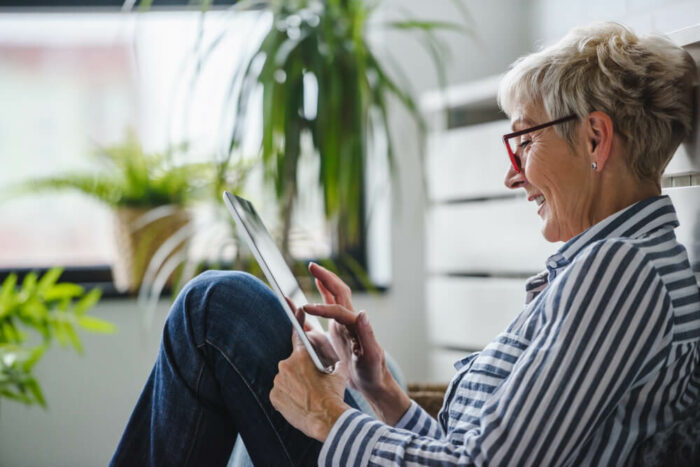 woman looking at tablet