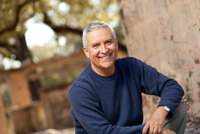 senior male with gray hair smiling