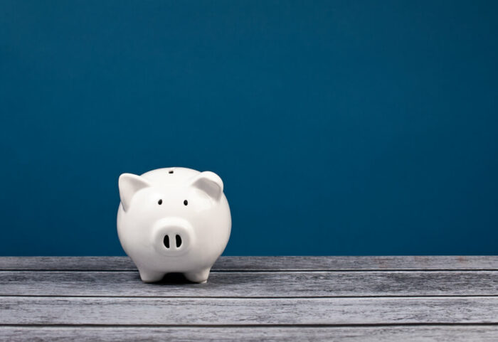 white piggy bank with blue background